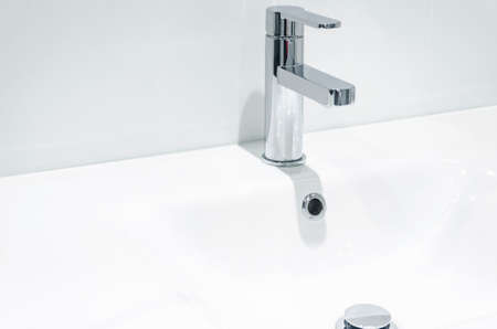 Mixer cold hot water. modern bathroom faucet. Kitchen tap. Isolated white background. Chrome plated metal.の写真素材