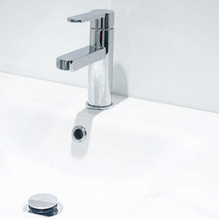 Mixer cold hot water. modern bathroom faucet. Kitchen tap. Isolated white background. Chrome plated metal.の写真素材