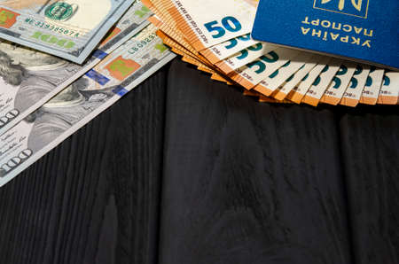Ukraine passports and money dollars, euros. Foreign biometric document proving the identity of a citizen of Ukraine.の写真素材