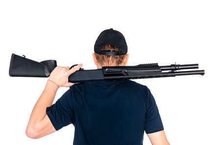 Hunter holding a rifle over his shoulder isolated on white backgroundの写真素材