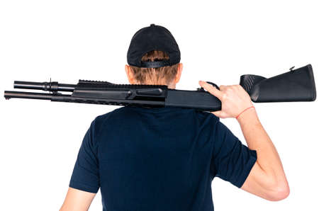 Hunter holding a rifle over his shoulder isolated on white backgroundの写真素材