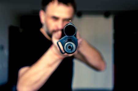 man holding a hunting rifle with a sight. Sight close upの写真素材