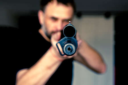 man holding a hunting rifle with a sight. Sight close upの写真素材