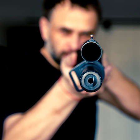 man holding a hunting rifle with a sight. Self-defense. Protection of Ukraineの写真素材