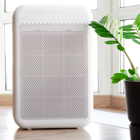 Air purifier in cozy home for filter and cleaning air and healthy Wellness life, Air Pollution Conceptの写真素材