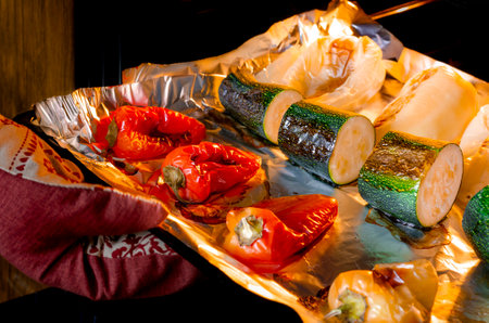 healthy eating. Vegetables baked in the oven. Pepper and zucchini with a ruddy crust are prepared in the oven.の写真素材