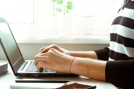 Business work on laptop. freelancer. Remote work in the home officeの写真素材
