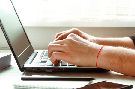 Business work on laptop. freelancer. Remote work in the home officeの写真素材
