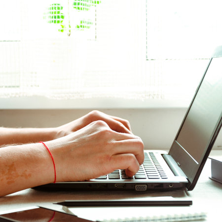 Business work on laptop. freelancer. Remote work in the home officeの写真素材