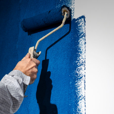 repair. Painting a white wall in blueの写真素材
