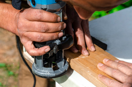 Woodworking shank router bit. Shaping copying shank router bit clamped in chuck of a working machine tool.の写真素材