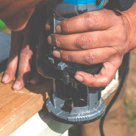 Woodworking shank router bit. Shaping copying shank router bit clamped in chuck of a working machine tool.の写真素材