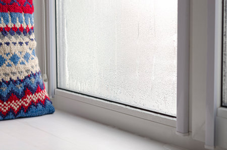 Drops of condensate and black mold on a substandard metal-plastic window. plastic. Ecologyの写真素材