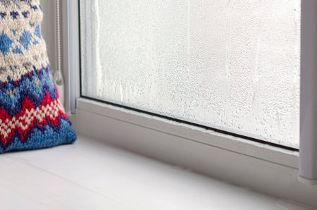 Drops of condensate and black mold on a substandard metal-plastic window. plastic. Ecologyの写真素材