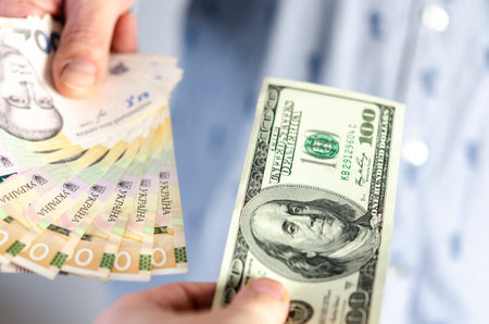 Currency exchange. Exchange of dollars for Ukrainian hryvniaの写真素材