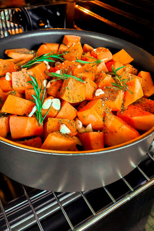 Healthy eating. Organic pumpkin baked with rosemary and garlicの写真素材