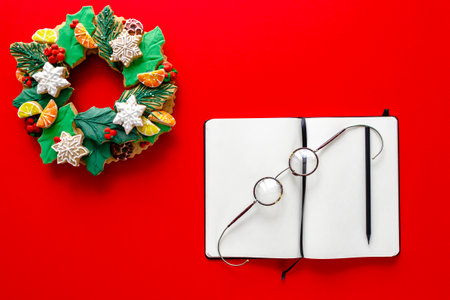 White notebook, round glasses and black pencil on bright background. Christmas Contentの写真素材