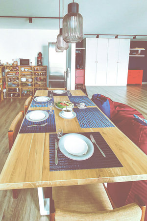 Wooden table in a minimalist Scandinavian interiorの写真素材
