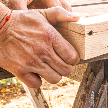 Hands close-up. Repair of wooden products.の写真素材