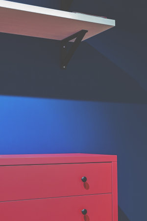 A red pedestal near a blue wall. Bright colors in the interiorの写真素材