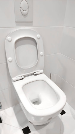 Plumbing. White toilet in the white bathroomの写真素材