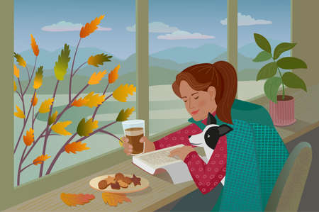 Pretty girl with dog reads the book and drinks the coffee seating next to the window.There is a pictorial autumn landscape with mountains and tree with yellow leaves outside the window.のイラスト素材