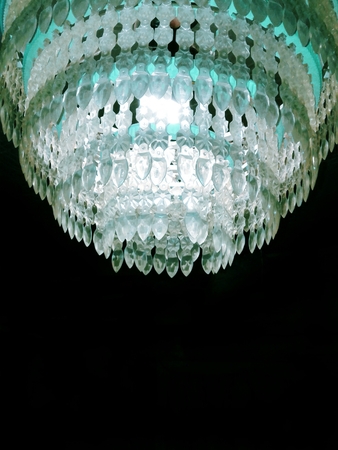 Vintage chandelier seventies on a black backgroundの写真素材