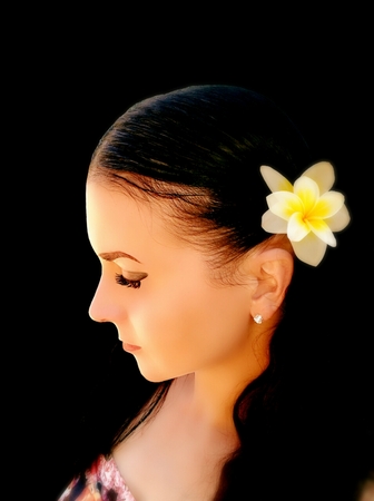 Brunette with long hair on black backgroundの写真素材