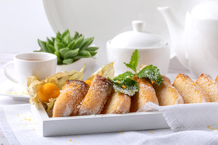 Cantuccini with physalis and mint on a white background