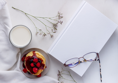 Plate with delicious pancakes with raspberries and berry sauceの写真素材