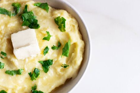 Homemade Mashed Potatoes, boiled puree, on white background, copy spaceの写真素材