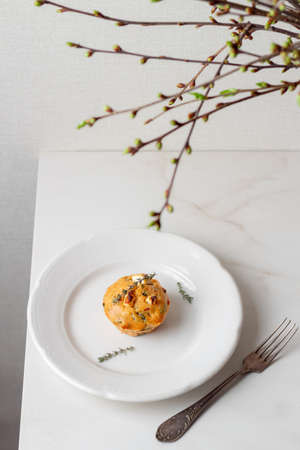Spinach Feta cheese breakfast muffins on a plate. White marble background.の写真素材