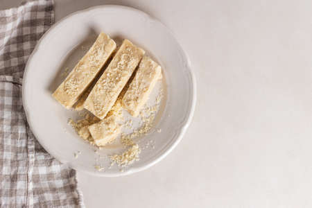 Homemade organic halva is dessert of Turkey. Sliced halva on the table.の写真素材