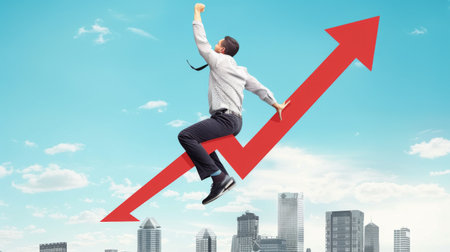Young businessman riding graph arrow going up.の素材