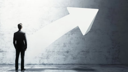 salesman standing in front of a big arrow pointing up.の素材