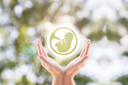the arm support embryo support to pregnant women, cent fertilizationの写真素材
