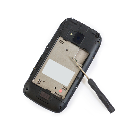 Disassembled mobile phone screwdriver repair phoneの写真素材