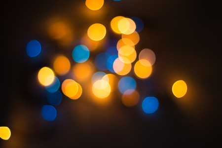 Lights blurred bokeh background from christmas night party for your design