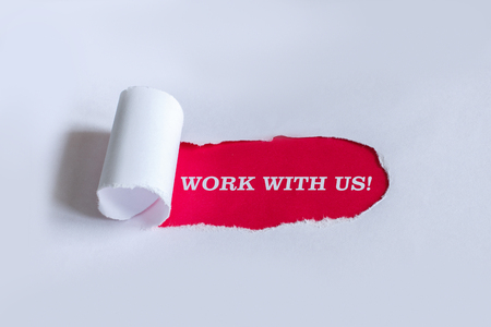 Torn paper with red background and text work with us.の写真素材