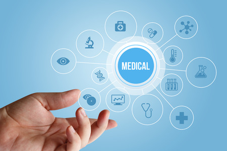 the doctor's hand show the word medical.の写真素材