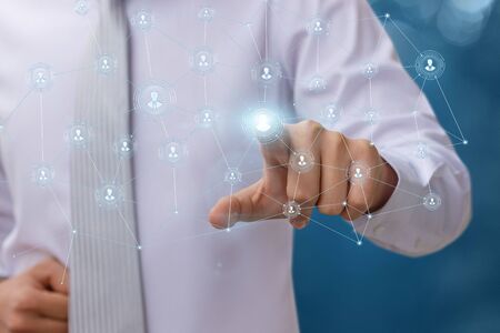 Businessman working with a team over a network.の写真素材