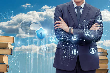 Businessman on the background of the protected cloud data in a network.の写真素材