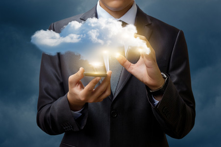 Cloud data from the mobile phone of the businessman.の写真素材