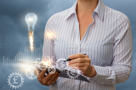 Businesswoman working with this checklist. Concept design.の写真素材