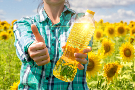 The farmer shows a good vegetable oil.の写真素材