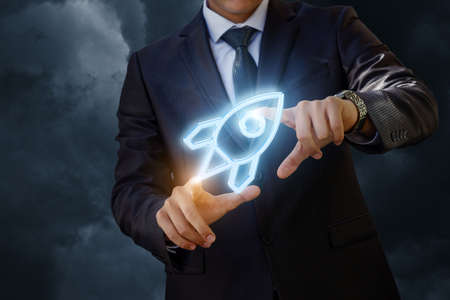 Businessman launches a missile . Start up project.の写真素材