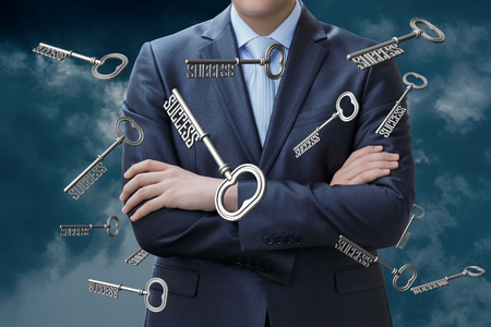 Businessman and keys . Concept success in business.の写真素材