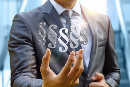 Businessman hand shows the paragraphs article. Concept design.