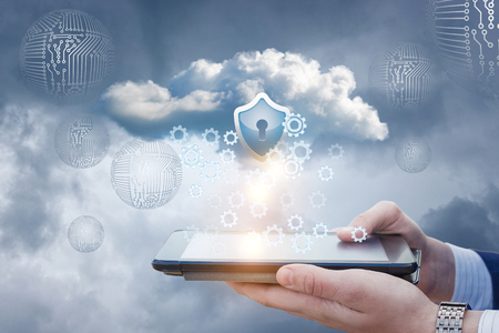 Businessman works with protected data cloud on the tablet. A concept design.の写真素材
