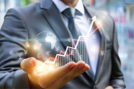 Businessman Shows profit growth on the chart. Concept design.の写真素材